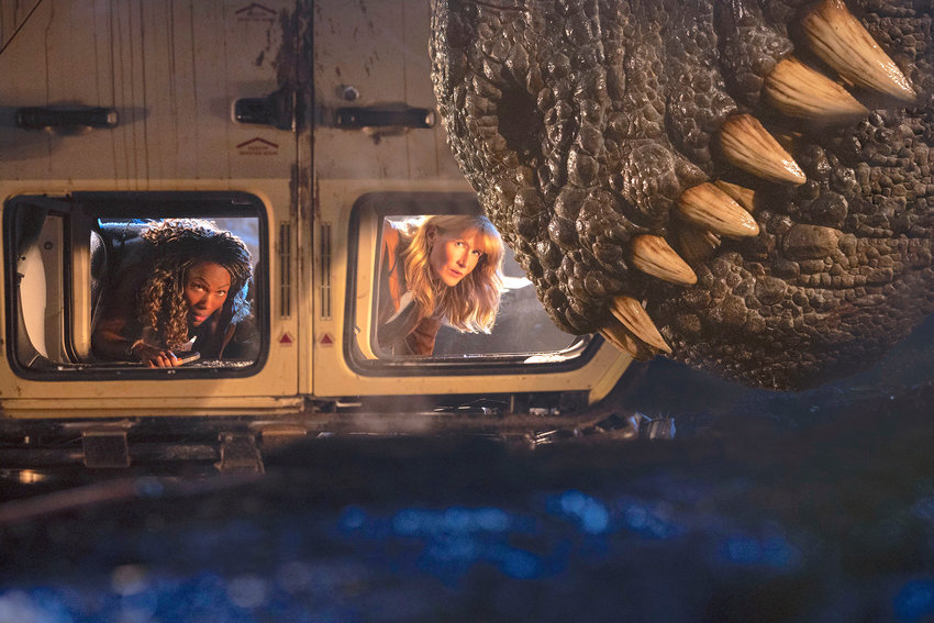 This image released by Universal Pictures shows DeWanda Wise, left, and Laura Dern in a scene from &quot;Jurassic World Dominion.&quot; (Universal Pictures and Amblin Entertainment via AP)