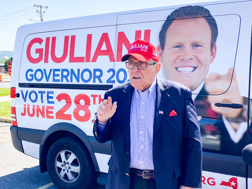 Rudy Giuliani speaks to a gathering at the parking lot of the Adirondack Bank Center on Monday during a brief stop in Utica for his son, Andrew Giuliani, in the latter&rsquo;s campaign for governor of New York.