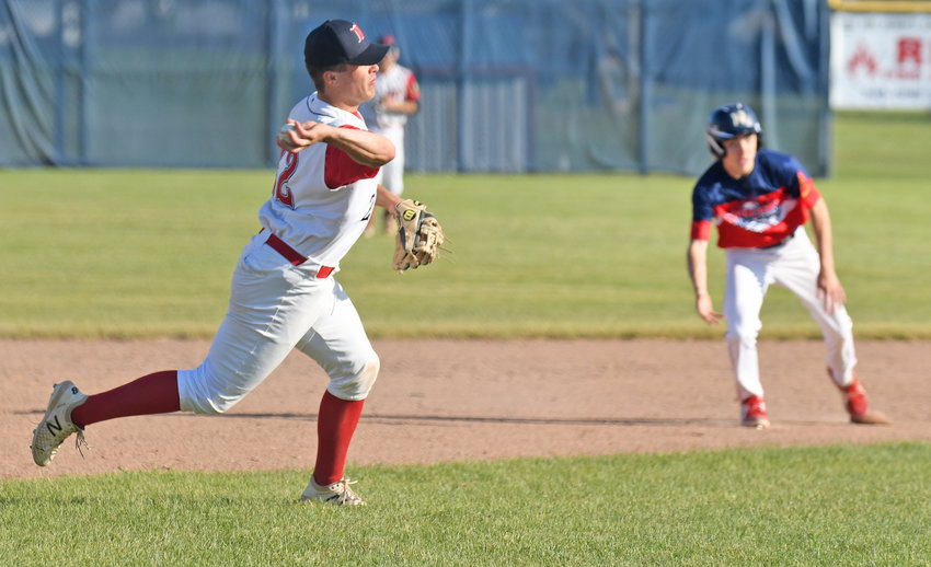 Whitestown third baseman Colin White makes a throw to first for an out in the third inning of the team&rsquo;s home game against New Hartford Post Monday. Whitestown won 9-1 and White had a single and drove in a run.
