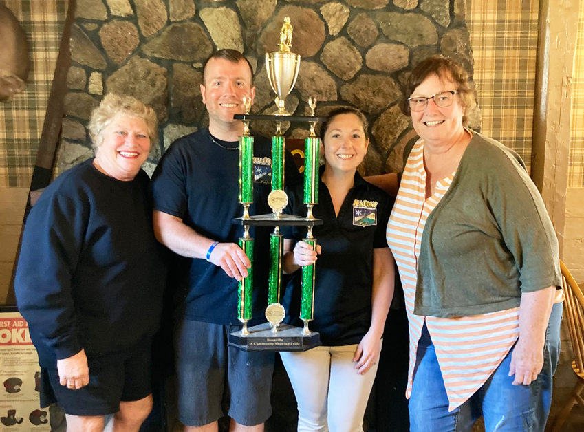 Seasons Cafe owners Jake and Erin Gydesen holding the Boonville Area Chamber of Commerce &lsquo;Business of the Month&rsquo; traveling trophy. At left is chamber director Lee Ann Greene, and at right is chamber vice president Patti McDaniel.