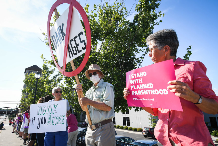 Protestors organize in response to the decision in Dobbs v. Jackson Women&rsquo;s Health Organization by the Supreme Court on Friday afternoon in front of Rep. Claudia Tenney&rsquo;s office at 430 Court St. in Utica.