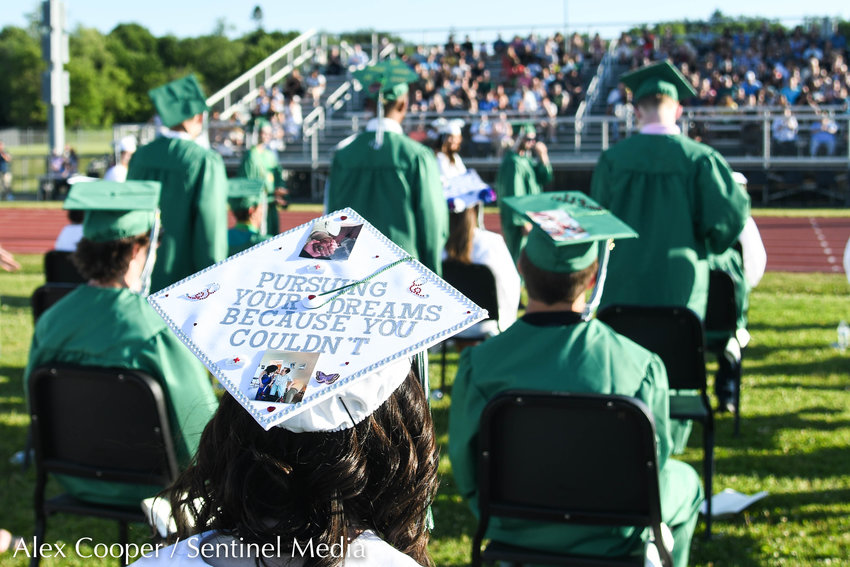 Graduate Alyvia Pizer wears a cap in honor of her grandmother during the annual commencement ceremony for Herkimer High School on Friday.