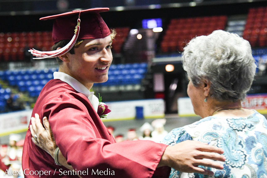 Graduate Angelo DeBrango receives a scholarship during the annual commencement ceremony for Frankfort-Schuyler on Sunday at the Adirondack Bank Center at the Utica Memorial Auditorium.