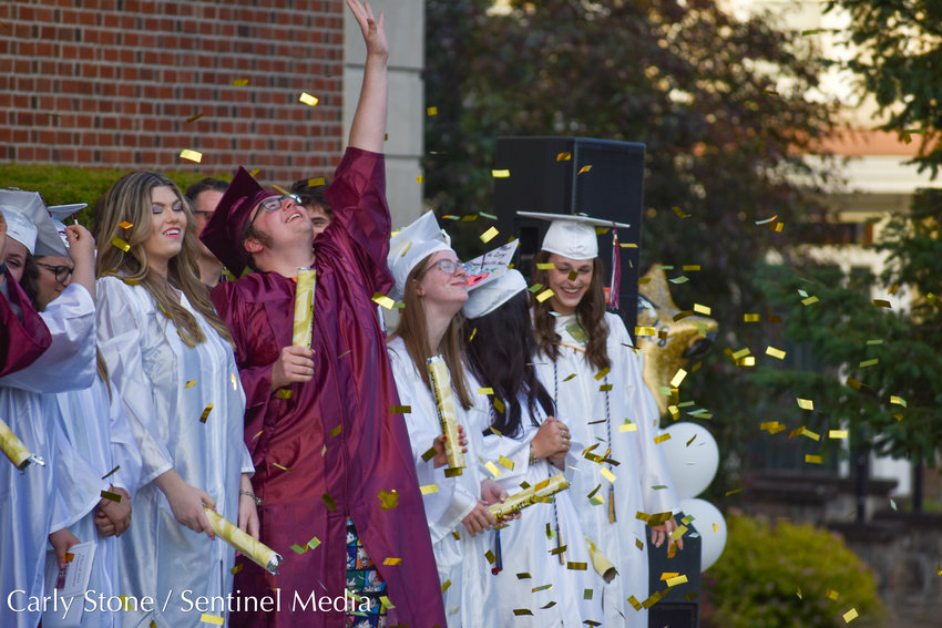 Ryan Seymour II looks to the sky with joy as celebratory confetti rains down on the newly graduated Class of 2022 from Oriskany High School.