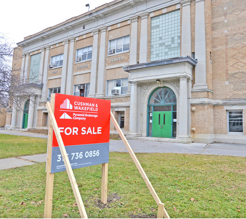 The former Fort Stanwix Elementary School, at 110 W. Linden St., in Rome, sits empty with a &ldquo;for sale&rdquo; sign in front in this Sentinel file photo. Efforts to sell the parcel continue, and the Rome City School District&rsquo;s board of education has approved a resolution to extend a contract with the Pyramid Brokerage Company to help sell the property.