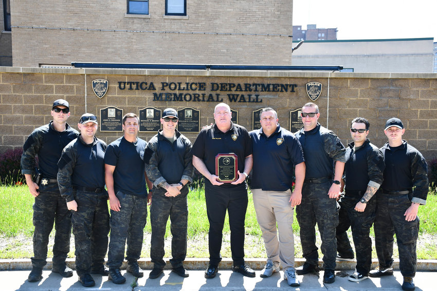 SWAT TEAM VICTORY &mdash;&nbsp;The Utica Metro SWAT Team was recognized as the winners of the Tactical Week training at the New York State Preparedness Center in Whitestown last week. Five SWAT teams from across the state competed in a series of high intensity training scenarios, and state officials said the Metro SWAT Team scored the highest. Here they are posing with Utica Police Chief Mark Williams, center. The Metro SWAT Team is comprised of officers from the Utica and New Hartford police departments, as well as the Oneida County Sheriff&rsquo;s Office.