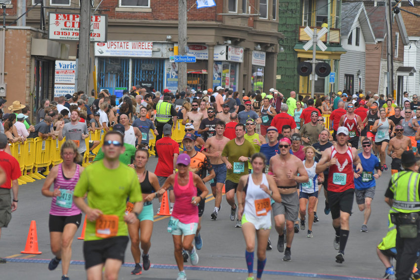 Runners make their way down Court Street during the Boilermaker Road  Race in 2019.