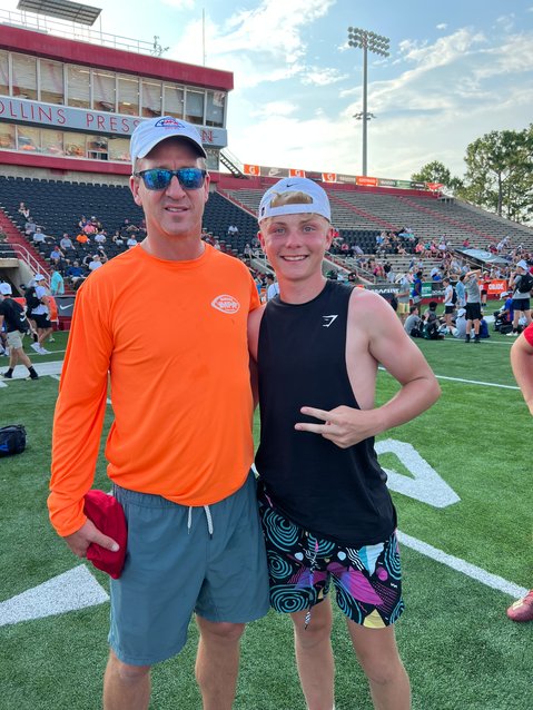 Rome Free Academy rising junior Evan Carlson-Stephenson, right, poses with NFL Hall of Fame quarterback Peyton Manning at the Manning Passing Academy football camp June 23-26 in Thibodaux, La.