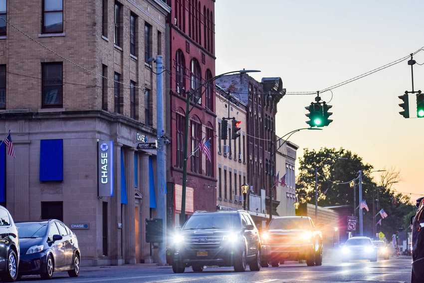 Cars pass through downtown Oneida on Wednesday. The city&rsquo;s final meeting of a panel for its Downtown Revitalization Initiative issued a host of recommendations to make the area more vibrant. (Sentinel photo by Carly Stone)