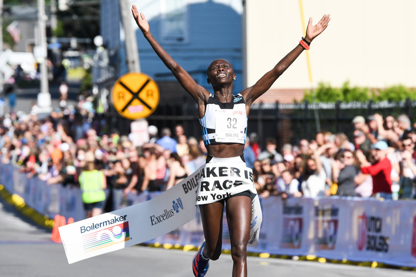 Rosemary Wanjiru celebrates after finishing first in the women's 15K during the 45th Boilermaker Road Race on Sunday in Utica.
