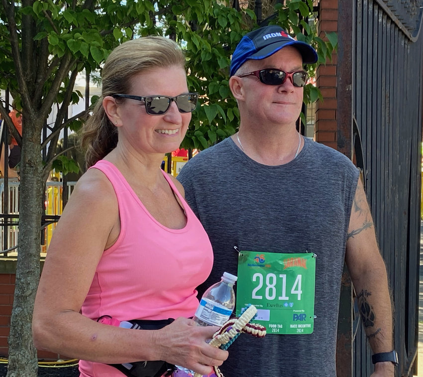 Lisa Swedick and William Smith pose together Sunday after running the Boilermaker 15K Road Race. Smith is visually impaired and ran the 15K for the first time with Swedick as a guide.