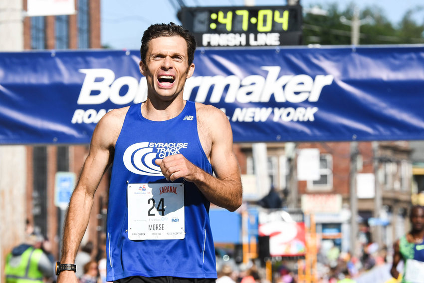Sam Morse of Camden crosses the finish line during the 45th Boilermaker Road Race on Sunday in Utica. Morse finished in 46:58.78, good for 21st place overall, and the best time among local runners. He finished second in 2021 in the race that was pushed back to October and was held without the invited elite runners.