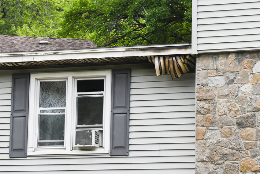 A home on Ridge Road in south Utica was damaged in an early morning fire on Tuesday, according to city fire officials. The residents escaped the home without injury, officials stated. Above, damage to the eaves shows where flames and smoke billowed out of the home as firefighters arrived on the scene.