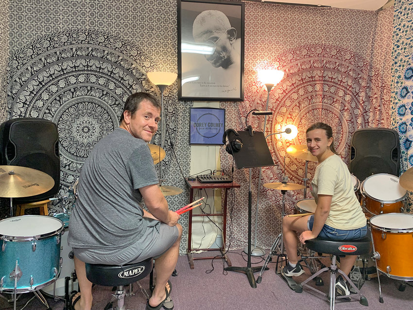 Drum instructor and musician Corey Colmey works with one of his students, Alyssa Tomassi, of New Hartford, inside his Rome studio. Colmey will hold his eleventh student recital, but his first since the COVID-19 pandemic, at Rome Alliance Church on Saturday.