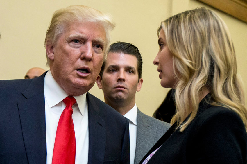 Former president Donald Trump, left, his son Donald Trump Jr., center, and his daughter Ivanka Trump speak during the unveiling of the design for the Trump International Hotel, in Washington, D.C., in this 2013 file photo. Trump and two of his children got their questioning postponed Friday in a New York civil investigation into their business dealings, a delay that follows the death of Trump&rsquo;s ex-wife Ivana.