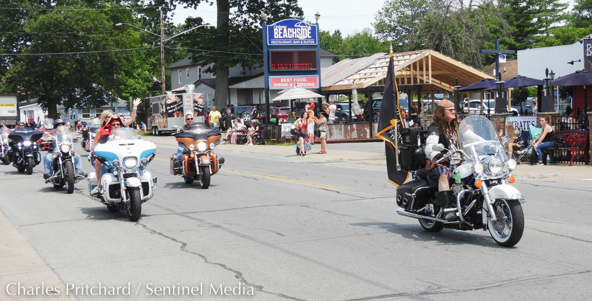 The Sylvan Beach Pirate's Parade makes its way down Main Street. Pictured are the American Legion Riders, some dressed in pirate garb, leading the parade.