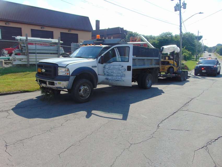 This dump-style truck and the forklift it&rsquo;s hauling were stolen from a business on North Genesee Street in Utica over the weekend. Utica Police said they found the truck Tuesday afternoon, and someone had tried to spray paint over the business name on the door. The driver has been charged.