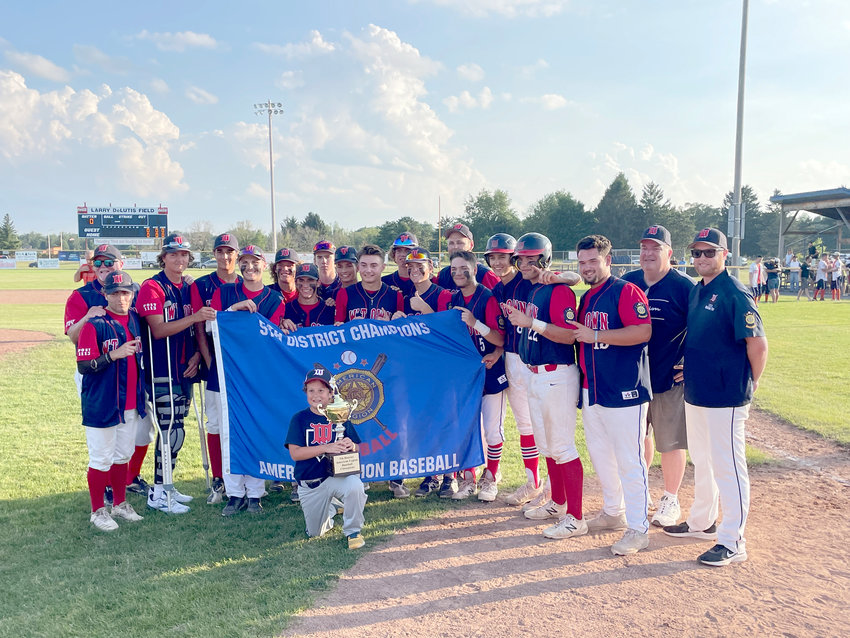 DISTRICT CHAMPS &mdash;&nbsp;The Whitestown Post American Legion baseball team holds up the District V championship banner it won Tuesday in a 1-0 win in eight innings over Smith Post of Rome at DeLutis Field in Rome. The team (20-2) will host District VI champion Harpursville (11-4) at 2 p.m. Saturday at DeLutis. The winner advances to the four-team state tournament that runs Tuesday through Thursday in Saugerties.