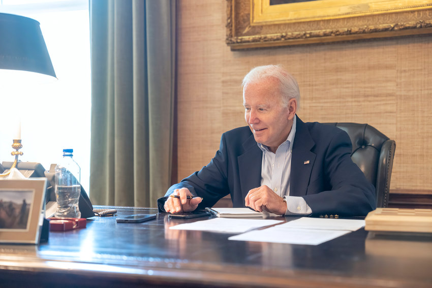 In this image provided by the White House, President Joe Biden speaks with Sen. Bob Casey, D-Pa., on the phone from the Treaty Room in the residence of the White House Thursday in Washington. Biden says he&rsquo;s &ldquo;doing great&rdquo; after testing positive for COVID-19.