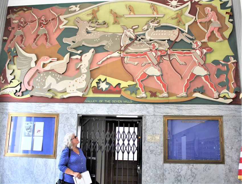 Cheri Sheridan of Cortlandville says the Cortland Post Office&rsquo;s mural by Ryah Ludins, seen here July 11, is a treasure.
