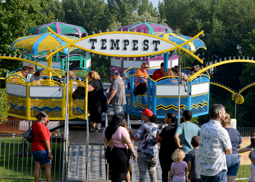 People loading up to go on the Tempest ride at the 2021 Canalfest celebration at Bellamy Harbor Park.