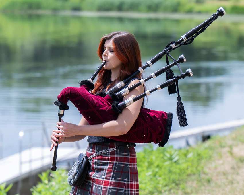 Ally the Piper plays the bag pipes in Collins Park in Scotia Wednesday, July 13, 2022.