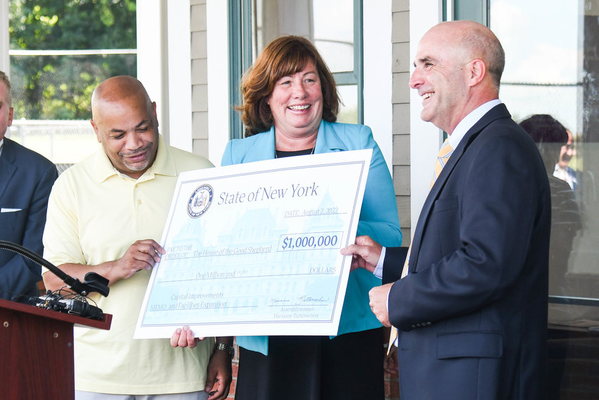 From left, Carl Heastie, Speaker of the New York State Assembly, Assemblywoman Marianne Buttenschon and CEO of The House of the Good Shepherd Brian McKee present a $1,000,000 check for The House of the Good Shepherd, located at 1550 Champlin Ave in Utica.