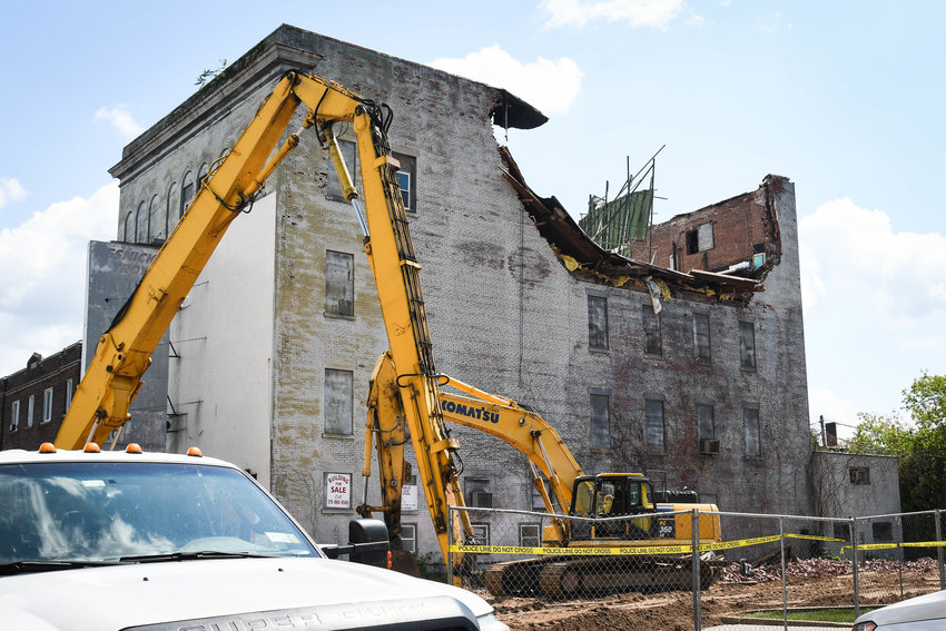Crews work to examine why this building at 113 Park Ave. in Herkimer partially collapsed Friday afternoon. Fire officials said decisions are still being made as to whether or not to demolish the rest of the structure. One woman was hospitalized after falling debris landed on her car, with her inside, officials stated.