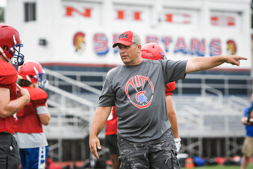 MAKING A POINT &mdash;&nbsp;New Hartford assistant coach Keith Kempney instructs players during a seven-on-seven football camp on Tuesday at Don Edick Field in New Hartford. The Spartans open the 2022 season on the road against Rome Free Academy at 6:30 p.m. on Friday, Sept. 2, at RFA Stadium.