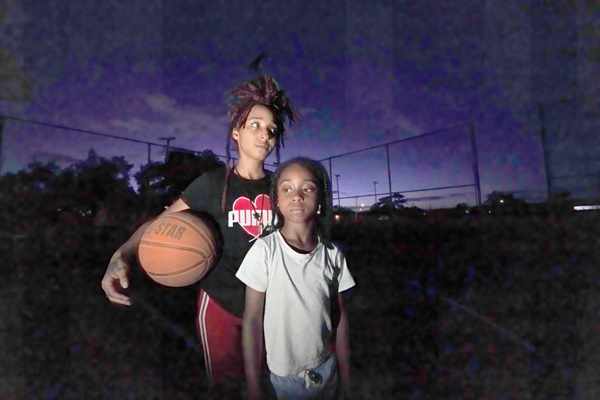 Jada Riley poses with her son Jayden Harris, 6, as they play on a basketball court near her former apartment, Thursday, July 28, 2022, in New Orleans. Two months behind on rent, Riley made the difficult decision last month to leave her apartment rather than risk an eviction judgment on her record. Now, she&rsquo;s living in her car with her 6-year-old son, sometimes spending nights at the apartments of friends or her son&rsquo;s father.  (AP Photo/Gerald Herbert)
