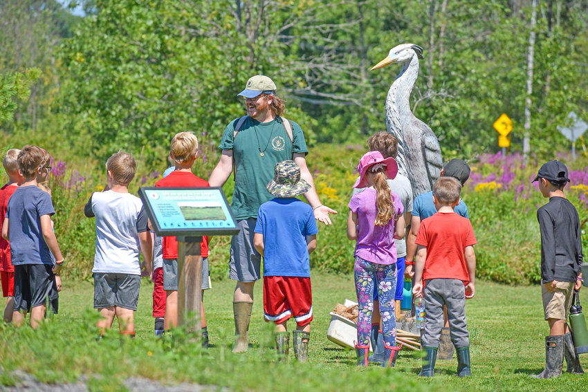 Environmental Educator Jack Silky guides children eager to explore the environment at the Great Swamp Conservancy in Canastota.