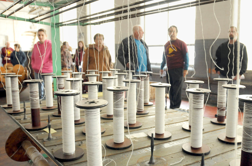 A group that toured the old Waterbury Felt Mill in Oriskany in 2014 got a first hand look at the Spinning room in the building that was the main location for winding the thread on spools.