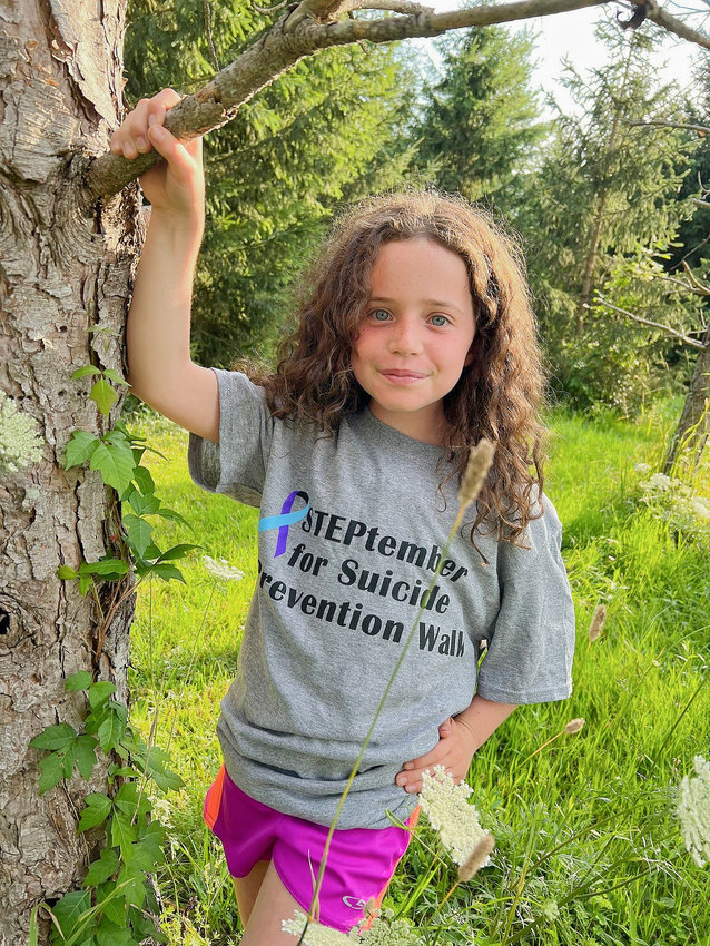 To help raise awareness, BRiDGES is holding its Steptember for Suicide Prevention event on Saturday, Sept. 10. Anyone can join this in-person walk at Chapman Park in Bridgeport. Pictured is Maddie Lisowski, wearing a STEPtember for Suicide Prevention Walk T-shirt.