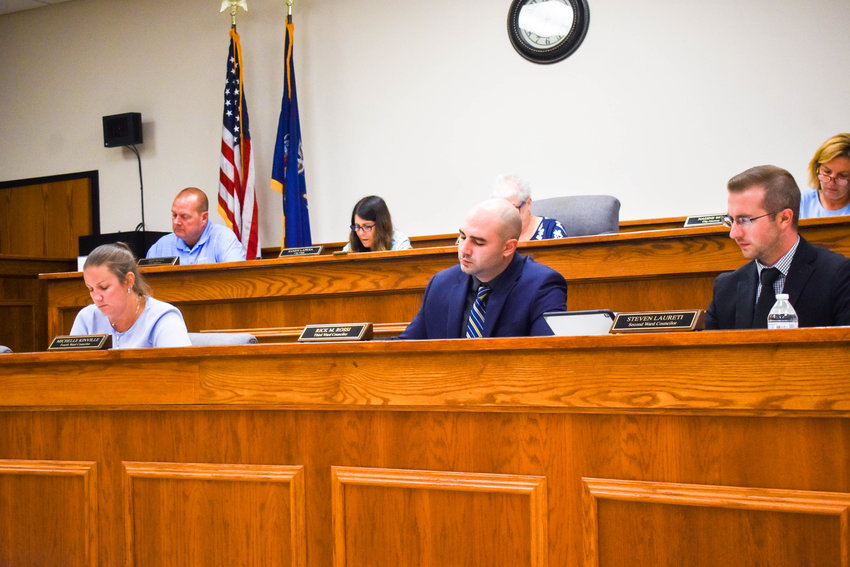 Members of the Oneida Common Council read over a resolution during their regular meeting on Tuesday at Oneida City Hall.(Sentinel photo by Carly Stone)