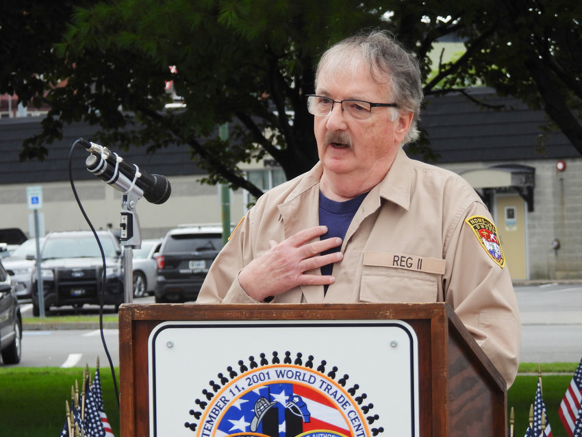 Former Madison County Undersheriff Douglas Bailey speaks at the city of Oneida's 9/11 Ceremony on Sunday, recounting his time as a member of the Federal National Disaster Medical System's Disaster Mortuary Response Team during 9/11