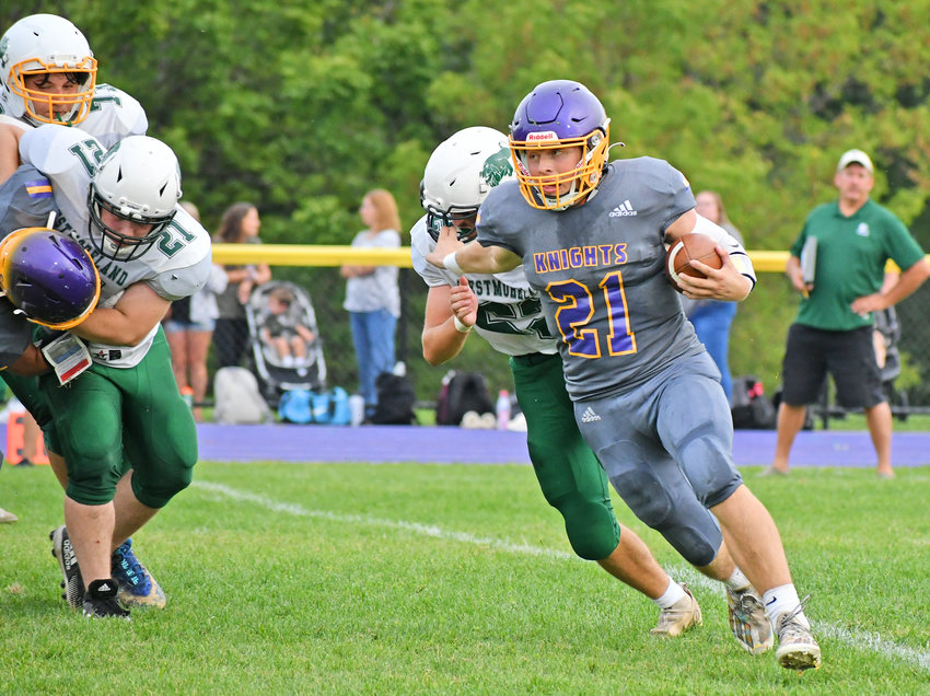 Holland Patent quarterback Jonathan Zylynksi stiff arms a defender as he scrambles against Westmoreland-Oriskany Saturday at home. The senior was 11-for-14 passing for 157 yards and two scores while running 17 times for 34 more yards plus another score. The Golden Knights won 43-8.
