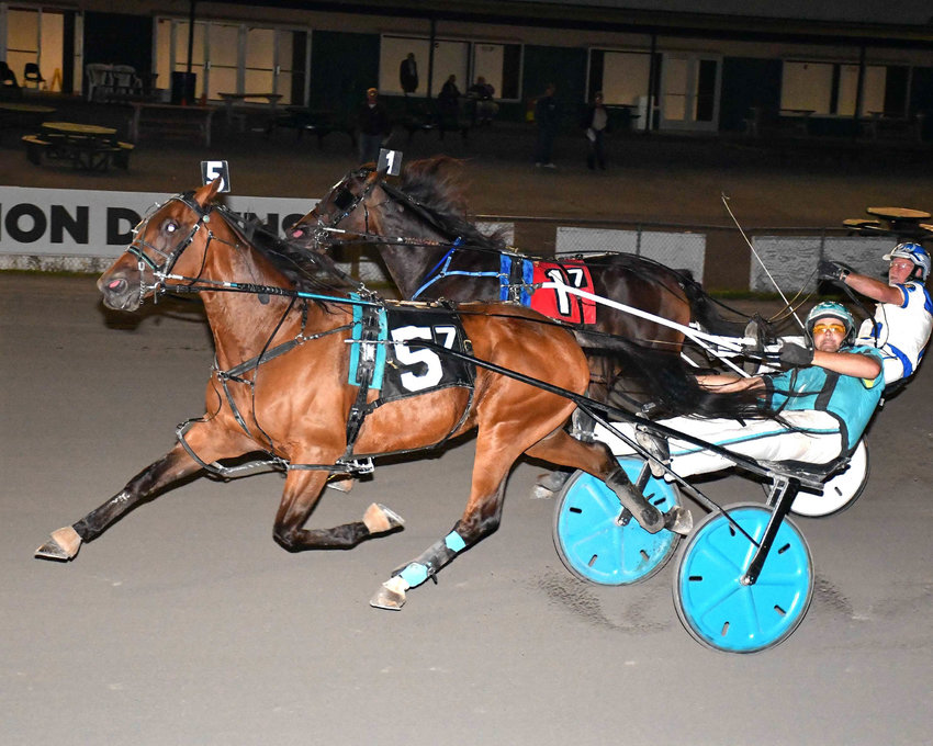 American JJ with Michael Miller driving was victorious in the featured $7,200 trot Saturday night at Vernon Downs.