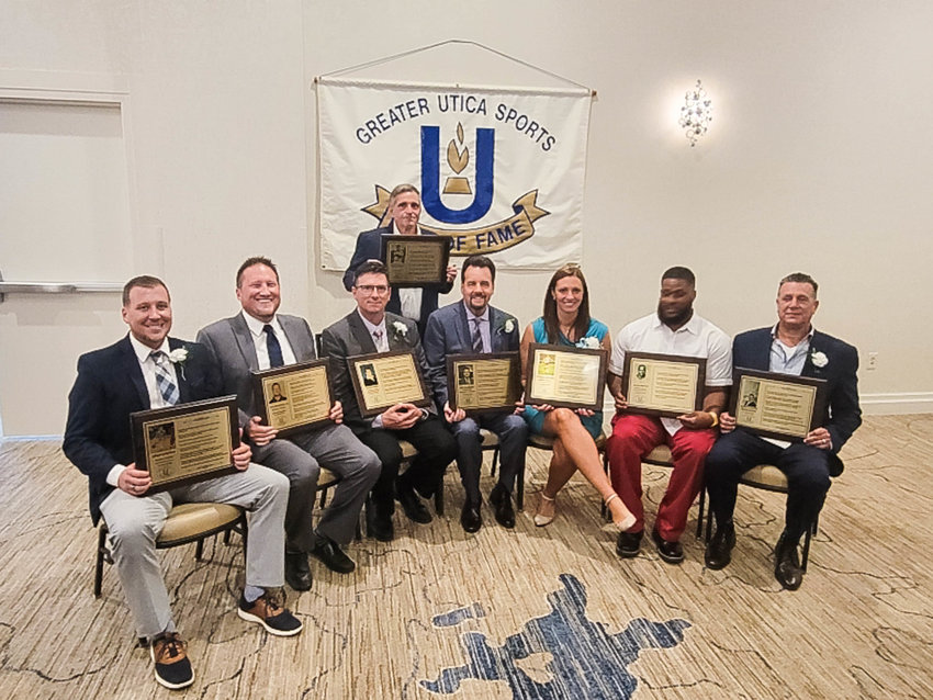 CLASS OF 2022 &mdash; The Greater Utica Sports Hall of Fame Class of 2022 was honored Sunday during the 32nd induction ceremony. Pictured from left, front row, are Sean Burton, Andrew Tarkowski, who accepted for Tom Myslinski Jr.; Todd Hobin, who accepted for his late sister Diane Hobin; Jim Jackson, Dominica (Reina) Paladino, Mizell Reed, who accepted for Dave Brown and Steve Babiarz. In back is Tom Giruzzi, who accepted for Antonio Mauro.