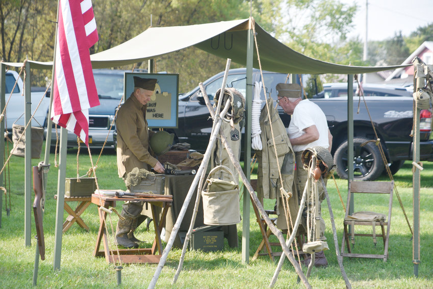 Kenny Gow of Binghamton, left, and Dan O'Brien of Endicott reenacted World War II Army life Saturday during the Military Vehicle Show at the Central New York Living Historcy Center in Cortlandfille. They said the recently enacted amendments to the state concealed carry law ban them from using disabled weapons during events at museums.