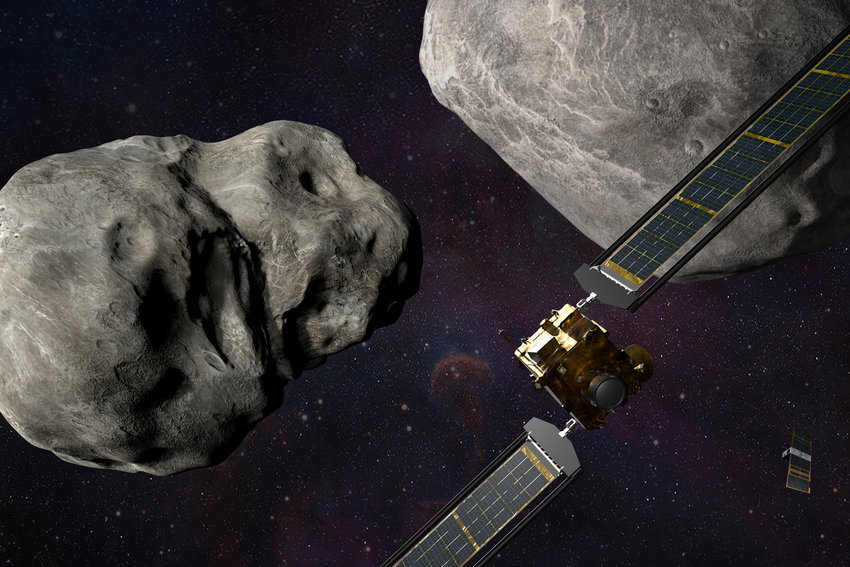 This illustration made available by Johns Hopkins APL and NASA depicts NASA's DART probe, foreground right, and Italian Space Agency's (ASI) LICIACube, bottom right, at the Didymos system before impact with the asteroid Dimorphos, left. DART is expected to zero in on the asteroid Monday, Sept. 26, 2022, intent on slamming it head-on at 14,000 mph. The impact should be just enough to nudge the asteroid into a slightly tighter orbit around its companion space rock.