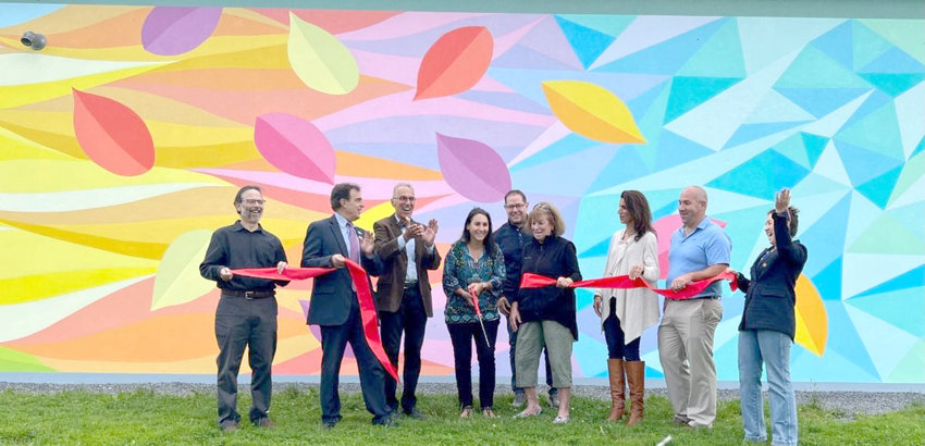 Partners in a mural project cut the ribbon to celebrate the unveiling of &ldquo;Seasons&rdquo; at the Roscoe Conking Park near the Parkway Recreation Center on Monday.  The mural aims to add an artistic creation to a family-friendly multicultural area.