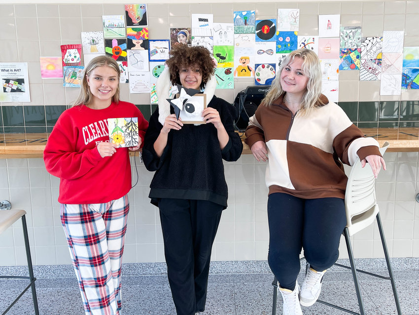 Herkimer Junior/Senior High School students, including, from left, Deyana Verenich, Layla Parham and Avery Richard, recently responded to their teacher's question of 'What is Art?' with artwork answers of their own.