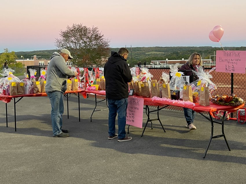 Fans at the Sauquoit Valley varsity girls soccer team peruse the basket raffles at the Think Pink game on Thursday, Sept. 29. A total of $925 was raised to benefit Mohawk Valley Health Systems and Rome imaging centers.