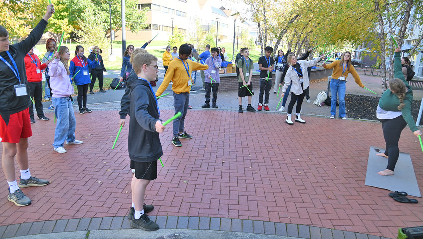 Instructor Amanda Cruikshank, right, leads area 9th graders in a POUND Music in Motion exercise Tuesday at SUNY Polytechnic Institute in Utica.