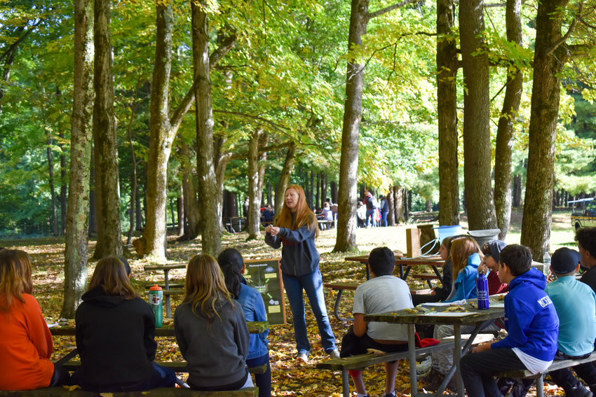 Colleen McEwen, an &ldquo;Ag in the Classroom&rdquo; educator from Cornell Cooperative Extension of Oneida County, shows students a tap for collecting sap from maple trees at the recent Conservation Education Days at Delta Lake State Park in Rome.