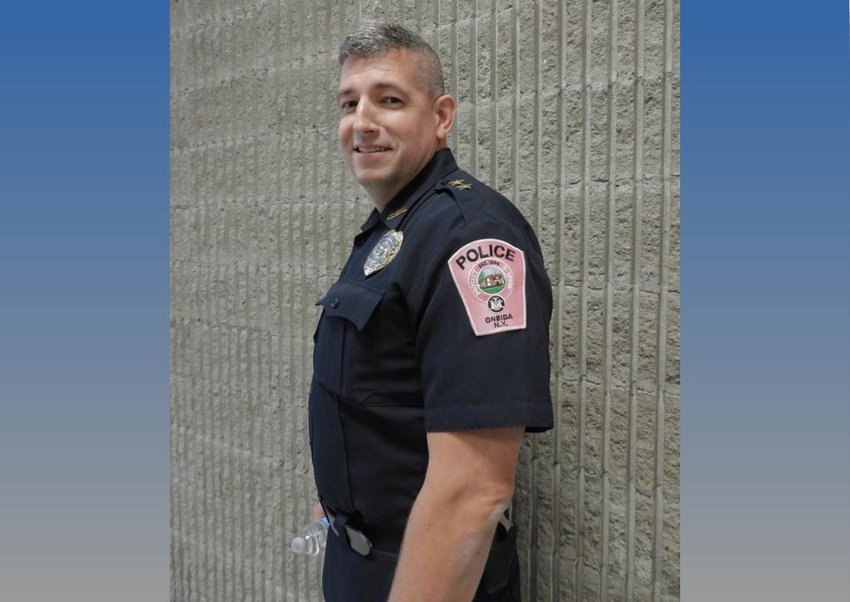 Oneida Police Chief John Little sports a pink shoulder patch, in honor of Breast Cancer Awareness Month. His agency is one of several local law enforcement agencies going pink for awareness.