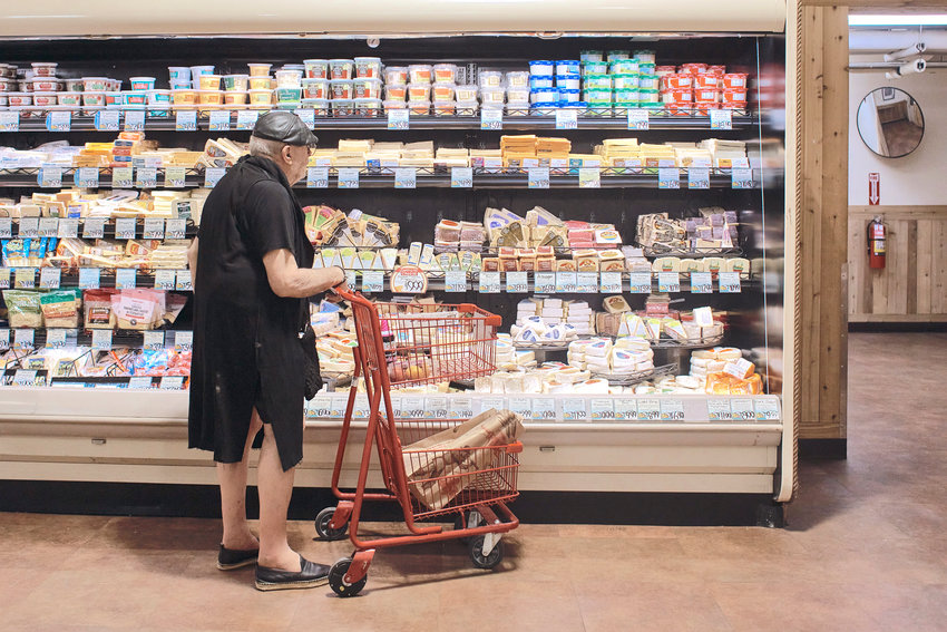 A man shops at a supermarket on July 27, in New York. On Oct. 13, the U.S. government is set to announce what&rsquo;s virtually certain to be the largest increase in Social Security benefits in 40 years. The boost is meant to allow beneficiaries to keep up with inflation, and plenty of controversy surrounds the move.