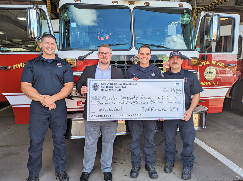 The Rome Fire Department raised $6,763.16 in its annual Fill the Boot fundraising drive for the Muscular Dystrophy Association. They handed over the money on Tuesday at the Central Fire Station on Black River Boulevard. From left: Firefighter Dustin Colgan; David Ciesielski of the Association; Firefighter Joseph Izzo; and Firefighter Mike Bottini.