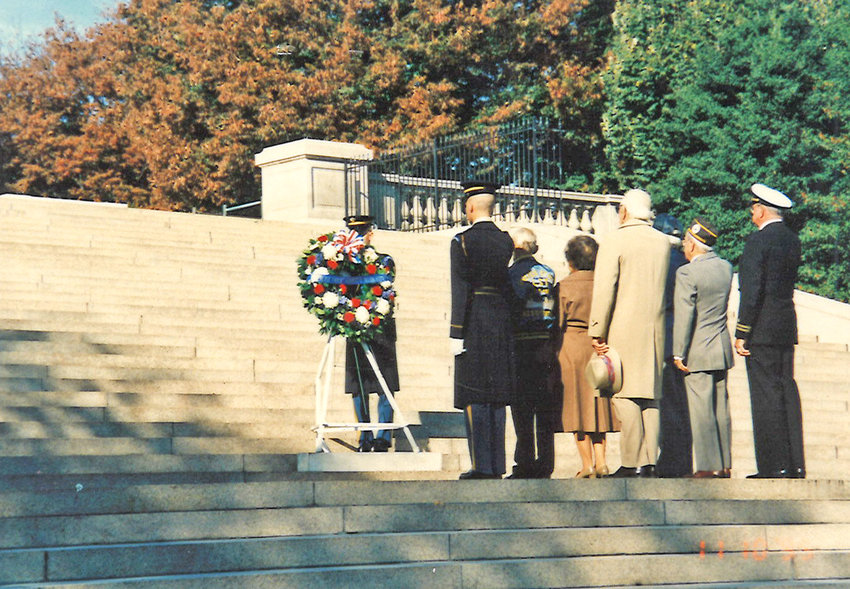 Margaret Mayes stands with survivors of Exercise Tiger for the Exercise Tiger Wreath Ceremony on Nov. 10, 1995.