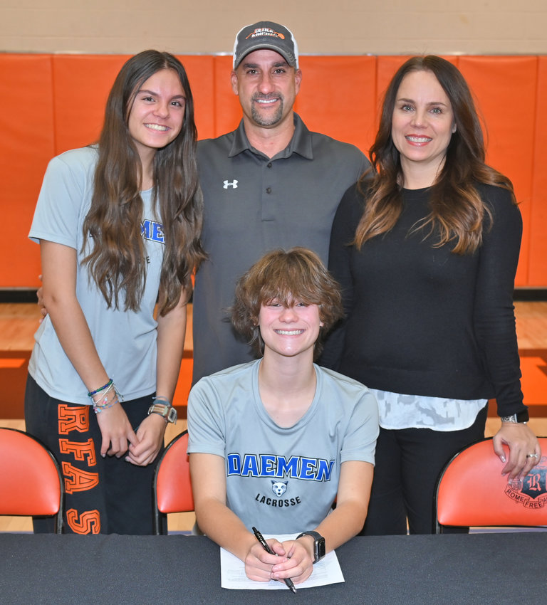 Rome Free Academy senior Shannen Calandra signs her National Letter of Intent to play Division II college lacrosse at Daemen University in Amherst, NY. With her, from left, are sister Chase, father Guy and mother Aaron.